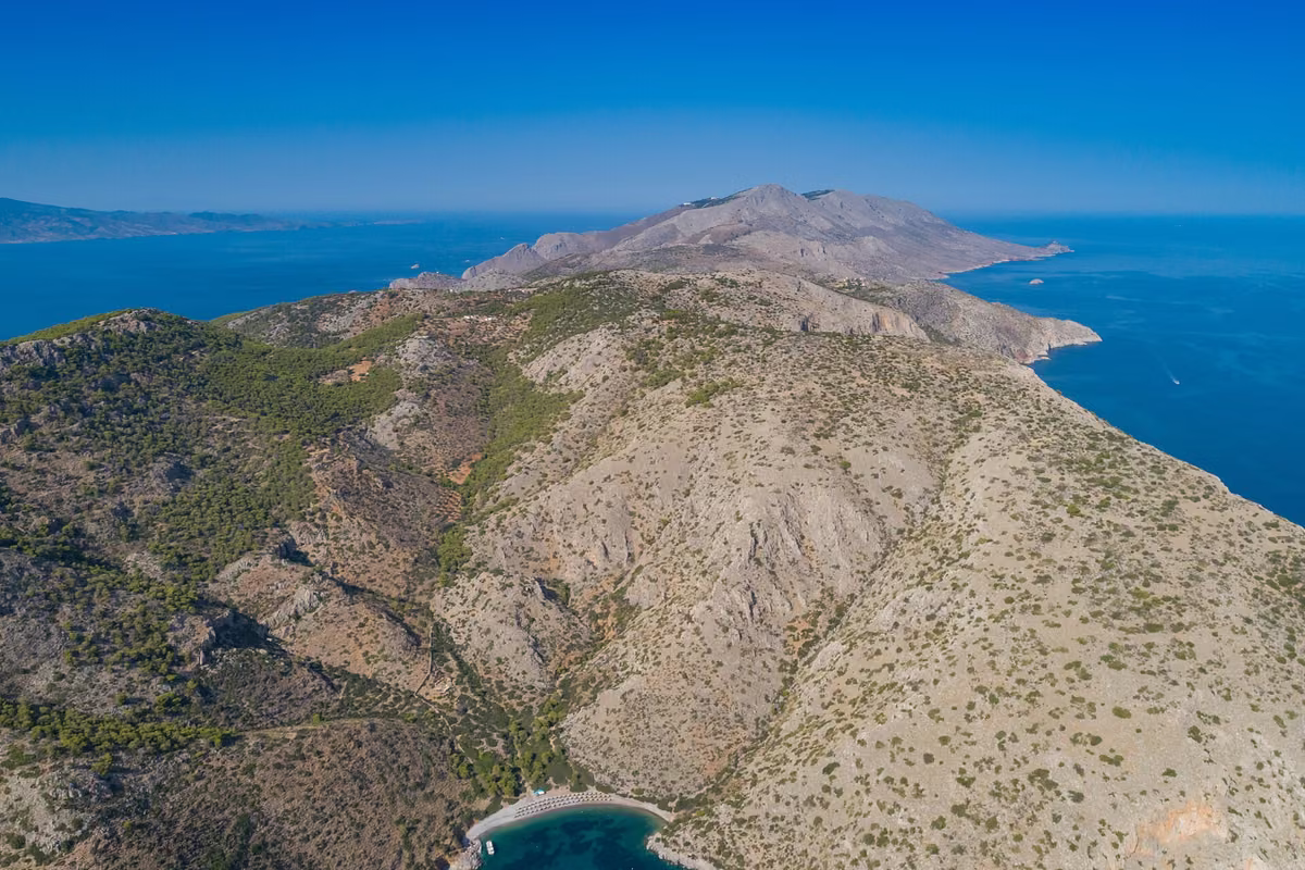 Hydra from the air: a long bare ridge dropping straight into the sea on both sides