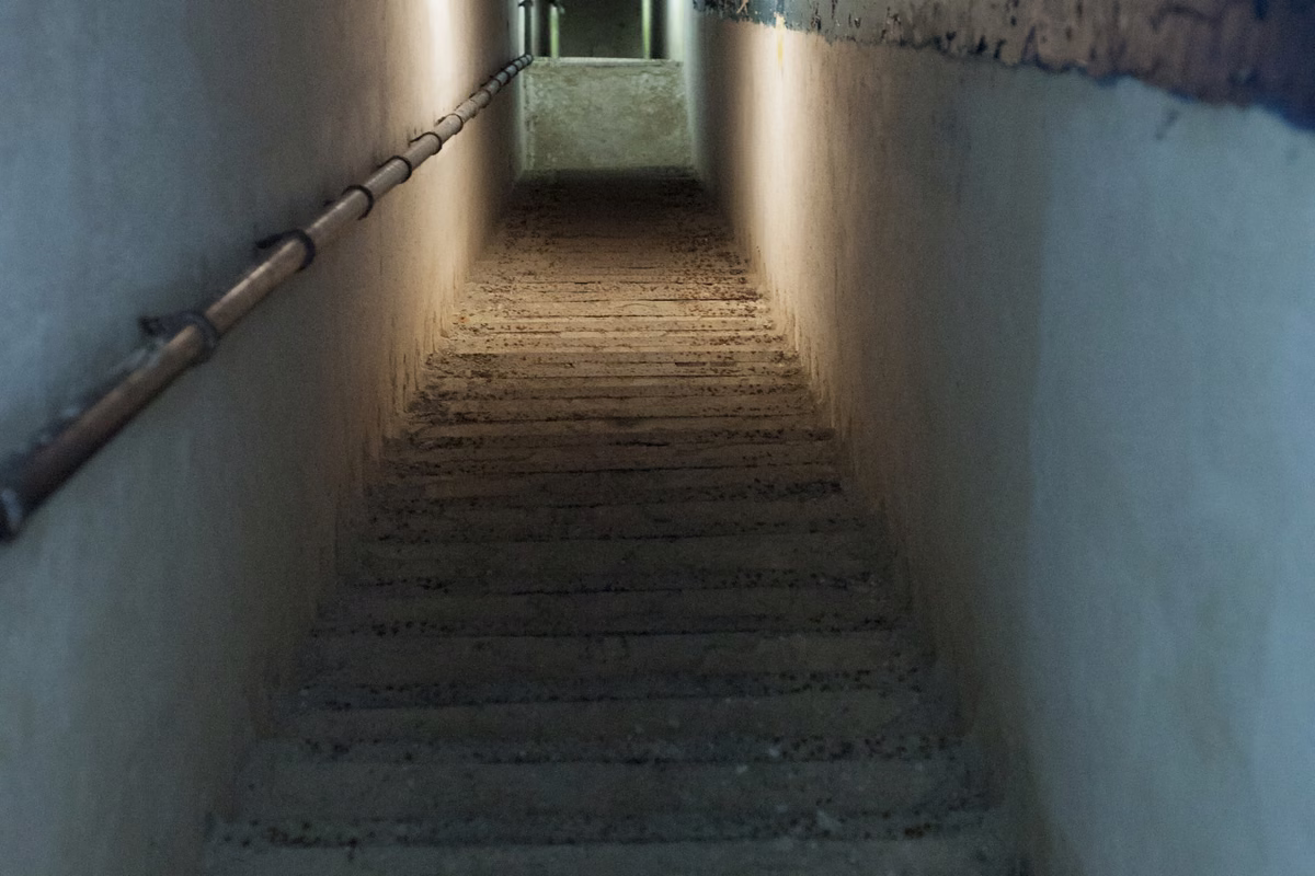 A long stairway down a whitewashed tunnel inside the fort